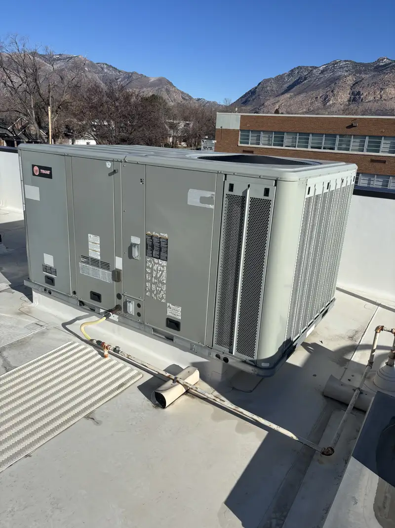 Commercial Trane rooftop HVAC unit with Wasatch Front mountain backdrop