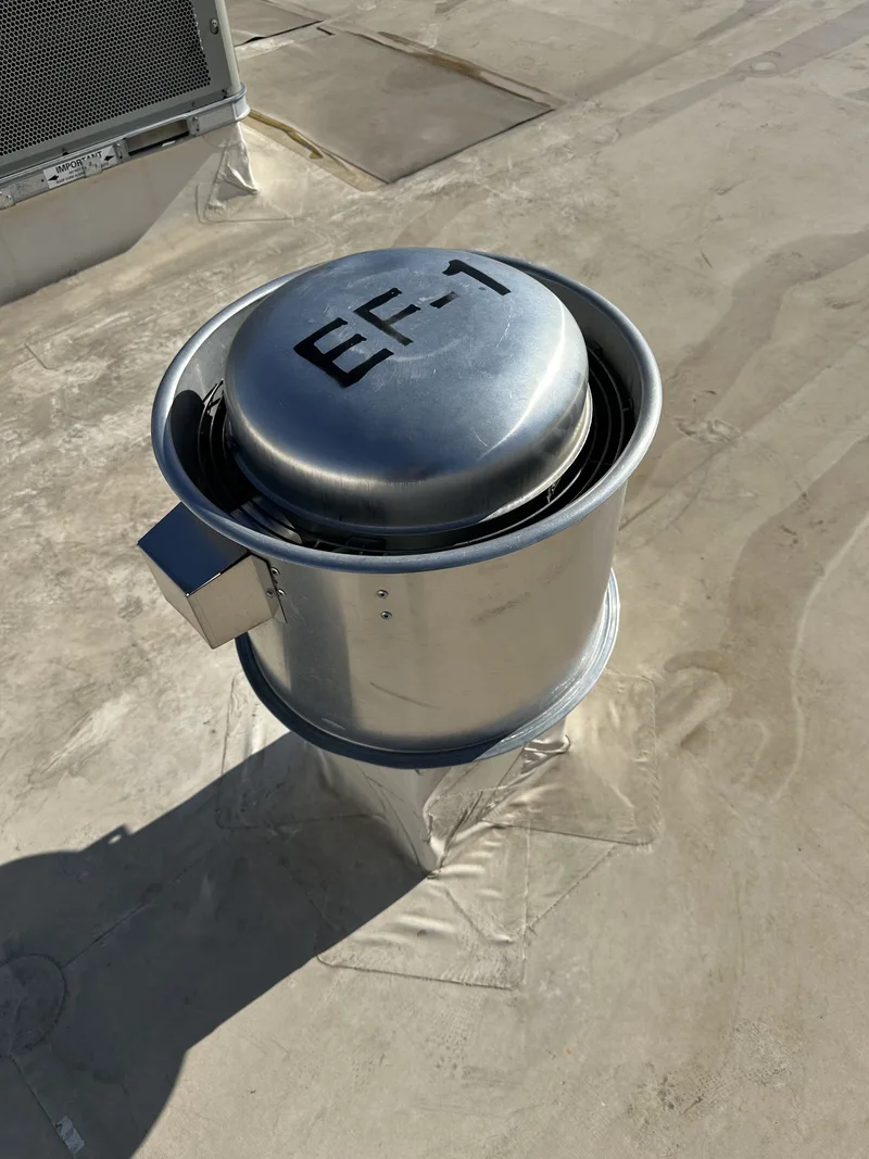 Commercial rooftop with exhaust ductwork and ventilation runs